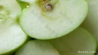 一个绿色的苹果旋转的微距镜头
